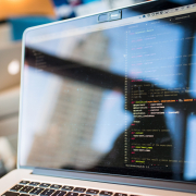 pexels-divinetechygirl-1181271 (1) Close-up of a laptop screen showing lines of code in a text editor with colorful syntax highlighting, blurred background.